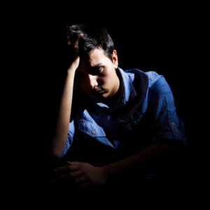 exhausted man image on hypnosis / hypnotherapy for anxiety page